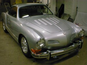 A classic, fully restored '74 Karmann Ghia. Currently, my father-in-law and I are working on a convertible version of the '74.